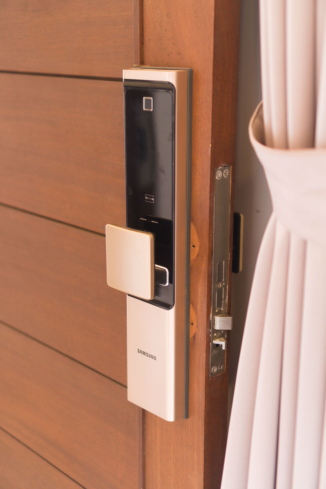 Champagne gold push-pull smart door lock with fingerprint sensor and glossy black panel